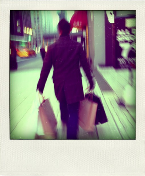 Man Walking with Shopping Bags